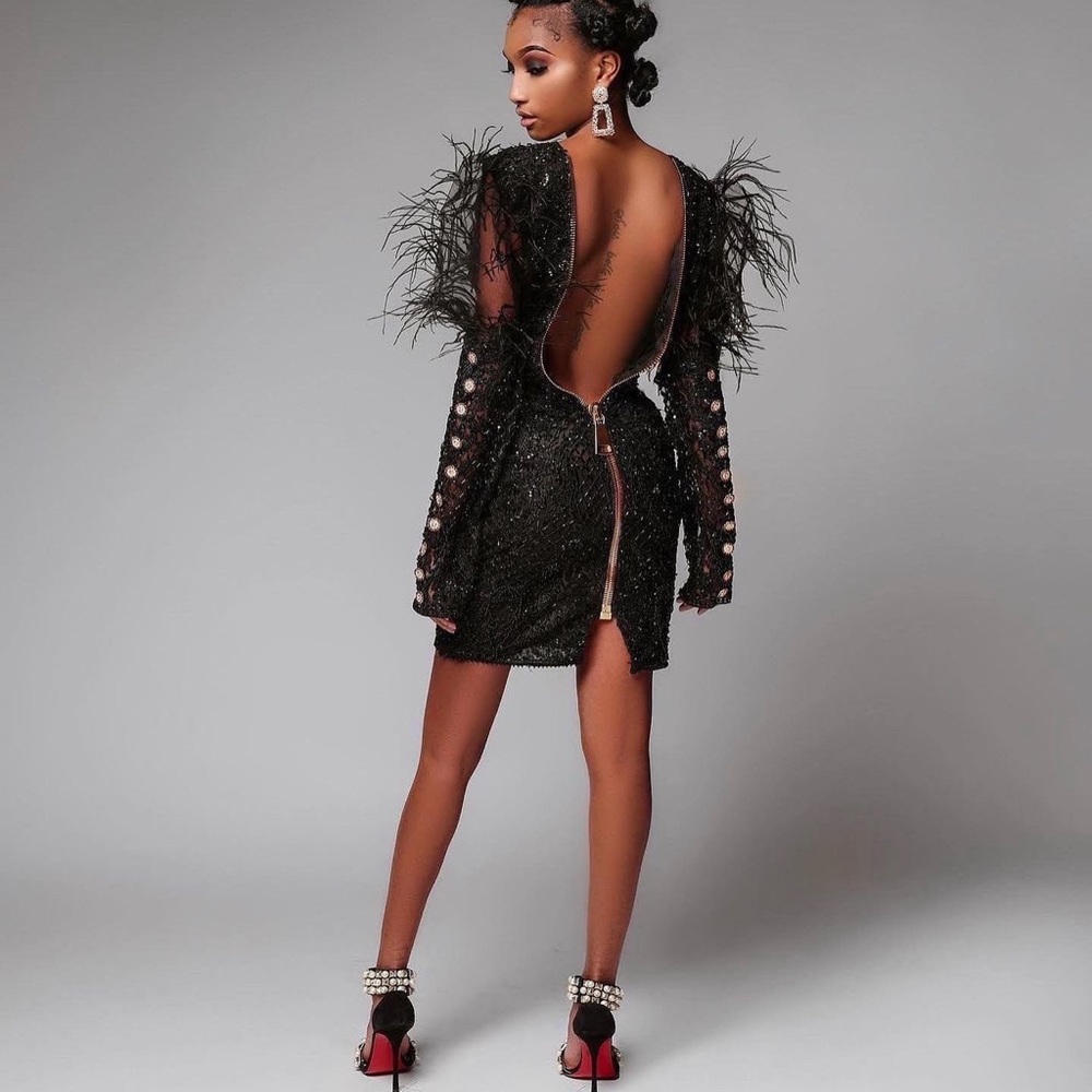 beaded dress with ostrich feathers, chunky back zipper and sleeve buttons